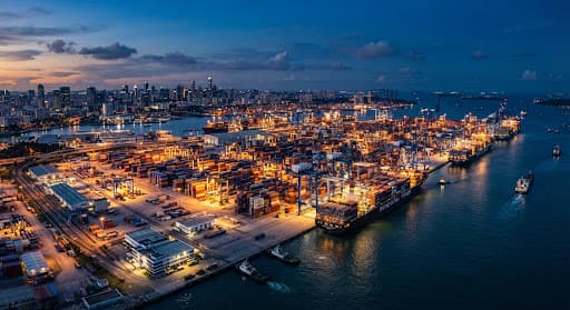 Aerial view of a modern shipping port at twilight